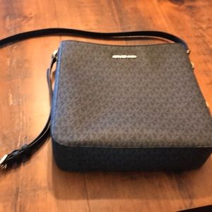 Hey set travel large logo messenger bag.  Micheal kors